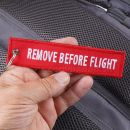Remove Before Flight RBF prívesok kľúčenka