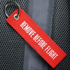 Remove Before Flight RBF prívesok kľúčenka